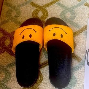 Smiley face slides wore only once